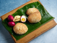 Pandesal or Filipino milk bread rolls and salted red egg ... image