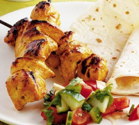 Chicken tikka kebabs with Indian salad recipe - BBC Good Food image