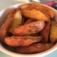Seasoned Baked Potato Wedges Recipe | Allrecipes image