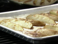 Roasted Potato Wedges Recipe | Jeff Mauro | Food Network image