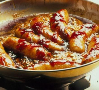 Sausages with sticky onion gravy recipe | BBC Good Food image