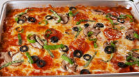 Keto Pizza Crust Recipe - Easy Low-Carb Pizza Crust - Delish image