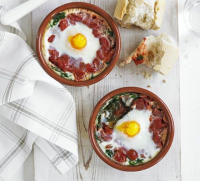 Baked eggs with spinach & tomato recipe - BBC Good Food image