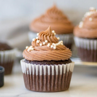 Chocolate-Caramel-Peanut Poke Cake Recipe - BettyCroc… image