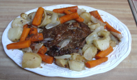 Oven Pot Roast With Carrots and Potatoes Recipe - Food.c… image